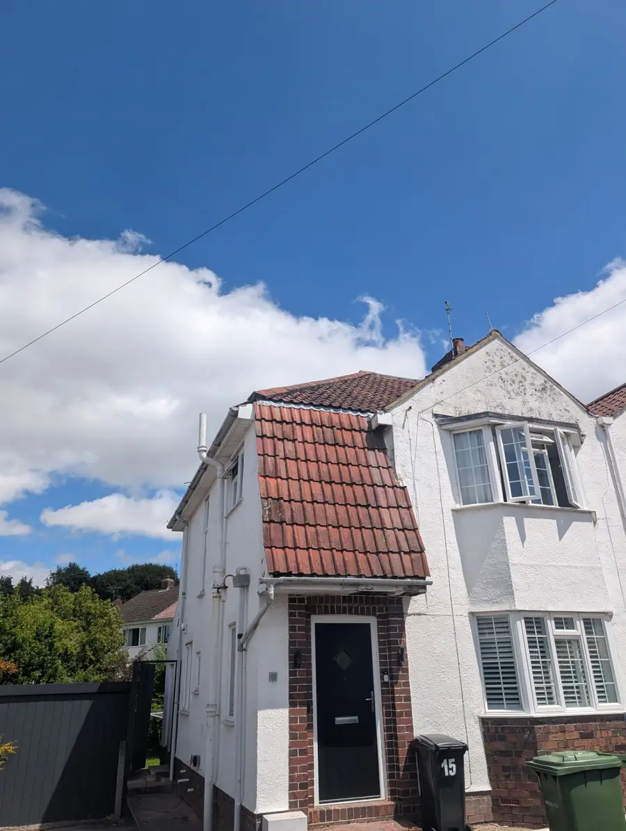 1930s semi-detached house with a tiled roof and chimney stack typical of Newcastle suburbs