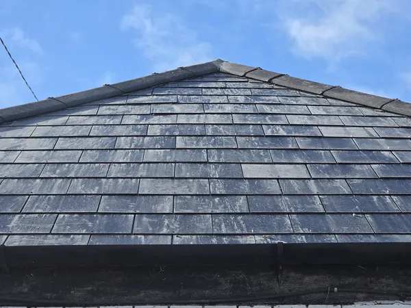 Completed new natural slate roof with dry ridge on a house in Newcastle