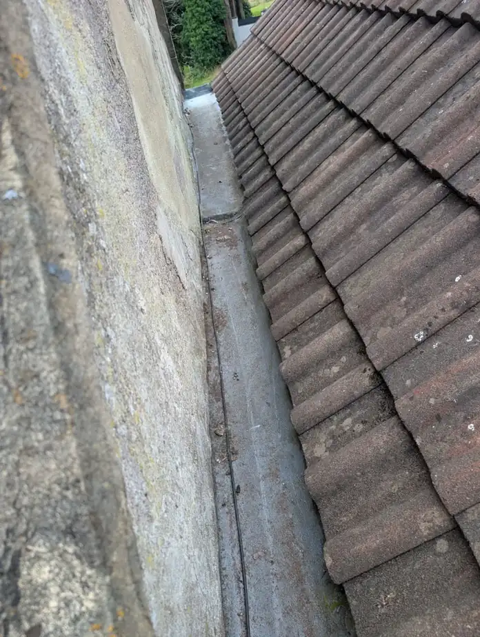 After: new Code 5 lead valley fitted between two tiled roof slopes in Newcastle