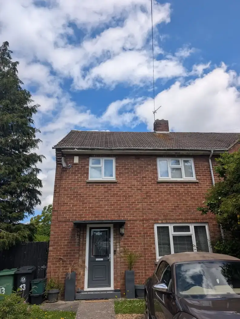 Semi-detached house with a tiled roof and clear sky, the type of Tyne and Wear home we repair most often