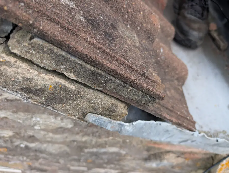 Slipped tile at a wall abutment, a typical Gateshead roof repair